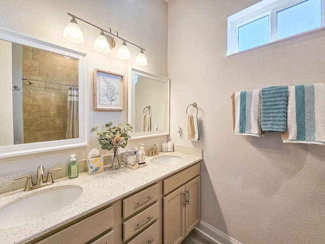 bathroom with vanity and curtained shower