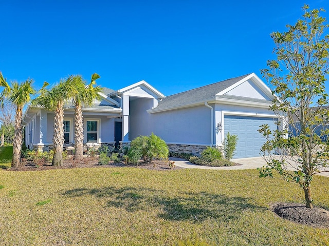 view of front of home with a garage and a front lawn