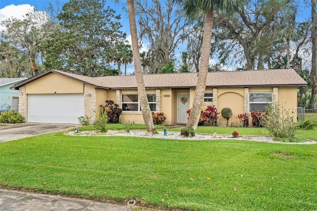 single story home with a garage and a front lawn