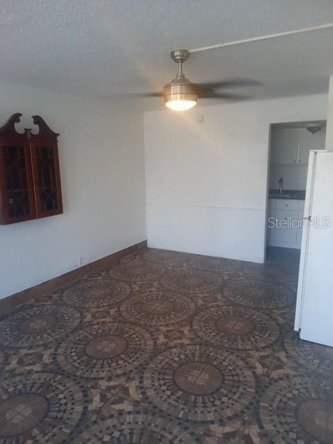 empty room with a textured ceiling