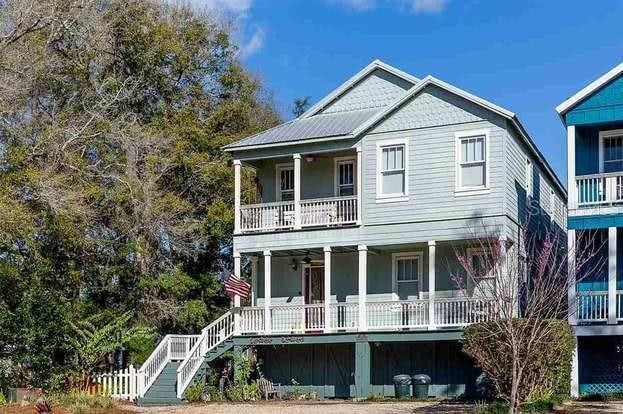 view of front of property with a balcony and a porch