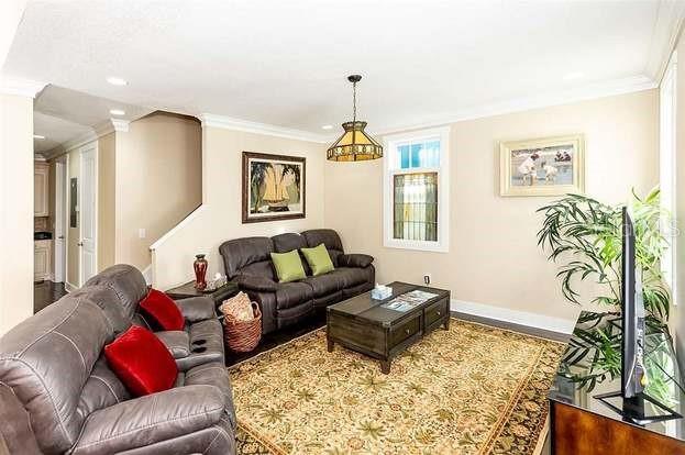 living room with ornamental molding