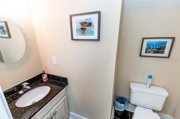 bathroom with toilet and vanity