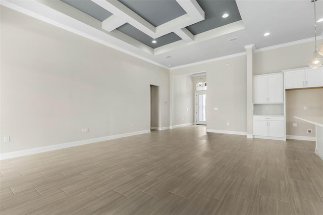 unfurnished living room featuring baseboards, coffered ceiling, a towering ceiling, ornamental molding, and recessed lighting