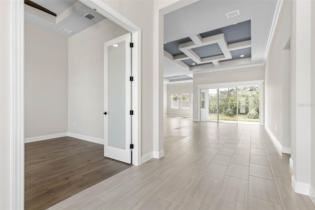 hallway featuring baseboards, coffered ceiling, beamed ceiling, and wood finished floors