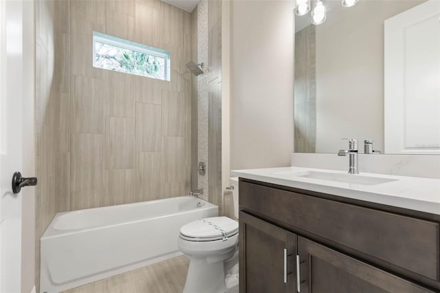 bathroom with toilet, shower / tub combination, and vanity