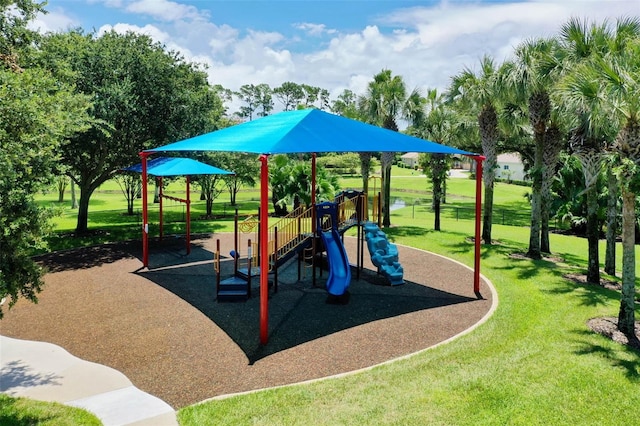 communal playground featuring a lawn