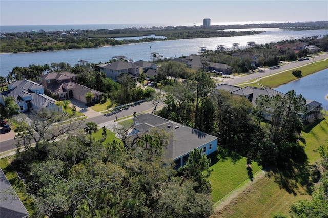 bird's eye view with a water view and a residential view