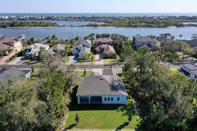 bird's eye view featuring a water view and a residential view