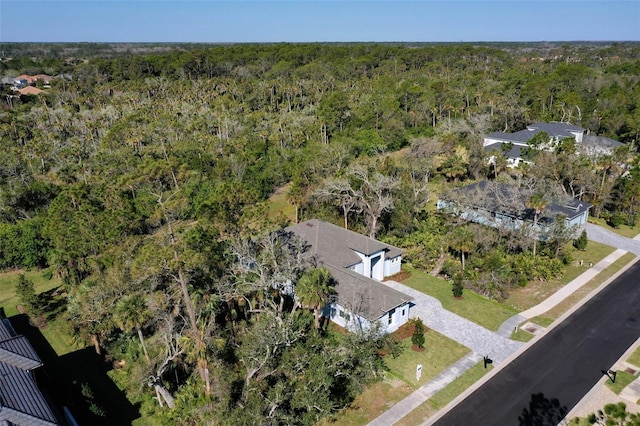 drone / aerial view with a view of trees