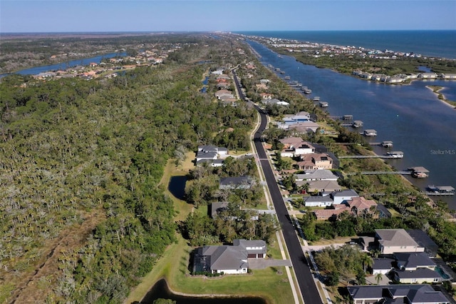 drone / aerial view featuring a water view and a residential view