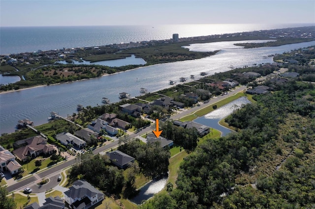 birds eye view of property featuring a residential view and a water view