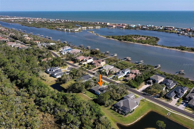 bird's eye view featuring a residential view and a water view