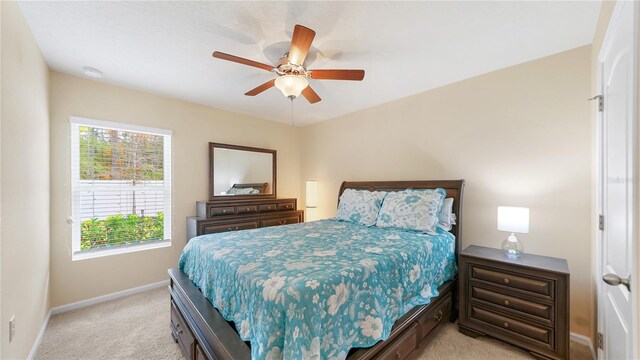 carpeted bedroom featuring ceiling fan