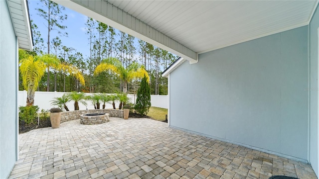 view of patio / terrace with an outdoor fire pit