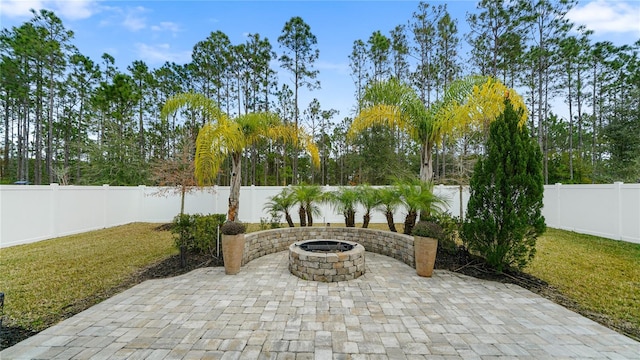 view of patio with a fire pit