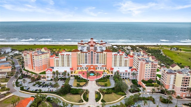 bird's eye view featuring a water view and a view of the beach