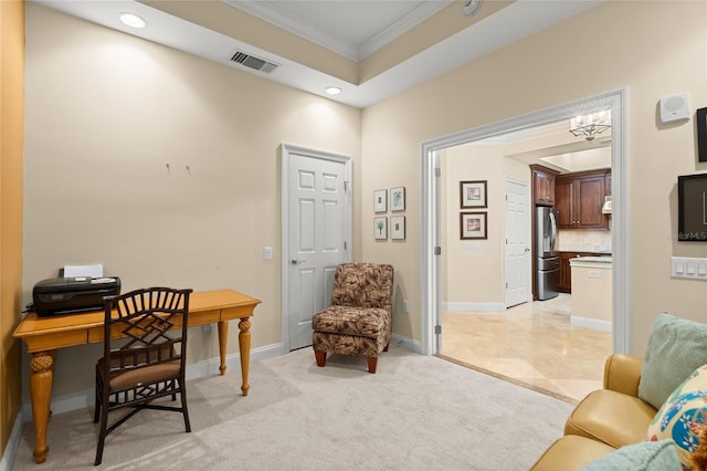 office area featuring a tray ceiling, light colored carpet, visible vents, ornamental molding, and baseboards