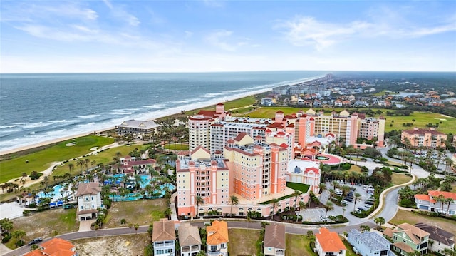 drone / aerial view with a view of the beach, a water view, and a city view