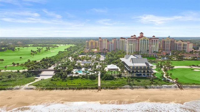 birds eye view of property featuring view of golf course, a water view, and a city view