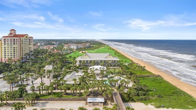 drone / aerial view featuring a water view and a beach view