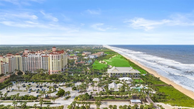 drone / aerial view with a water view and a view of the beach