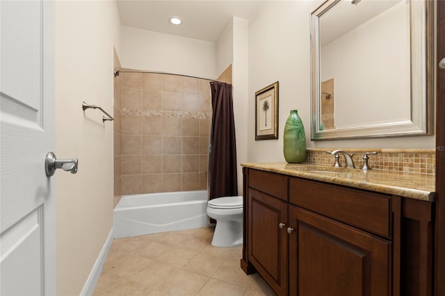 bathroom with tile patterned flooring, toilet, vanity, baseboards, and shower / bathtub combination with curtain