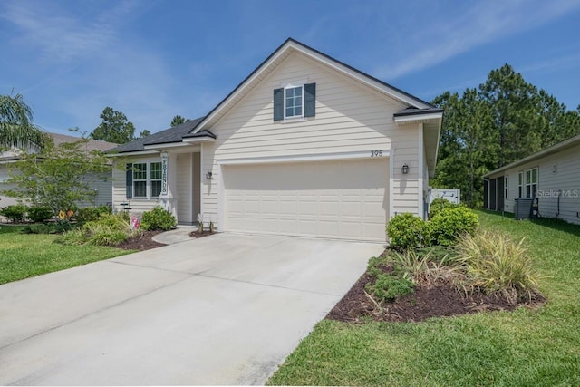 view of front of home with cooling unit, a garage, and a front lawn