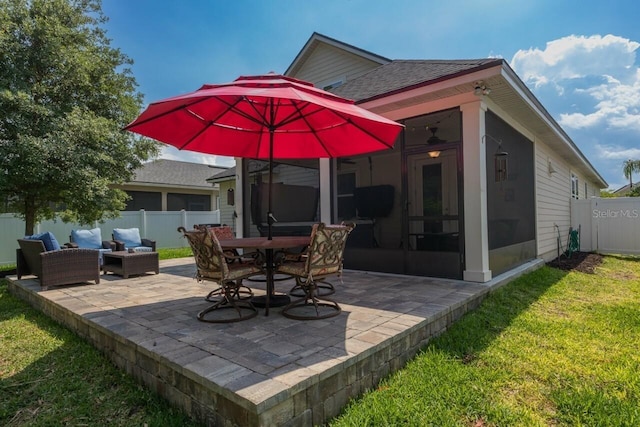 view of patio / terrace with ceiling fan, outdoor lounge area, and a sunroom