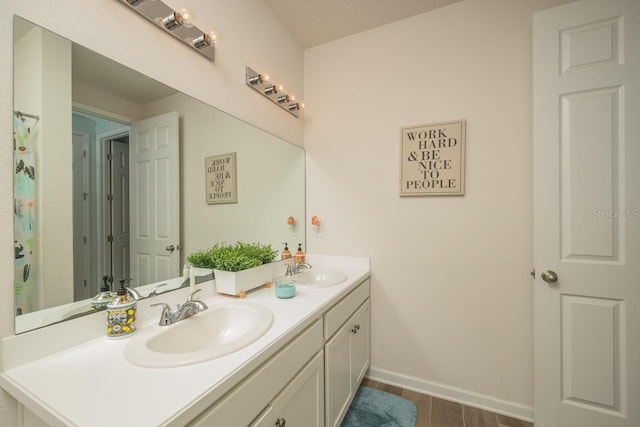 bathroom featuring hardwood / wood-style flooring and vanity