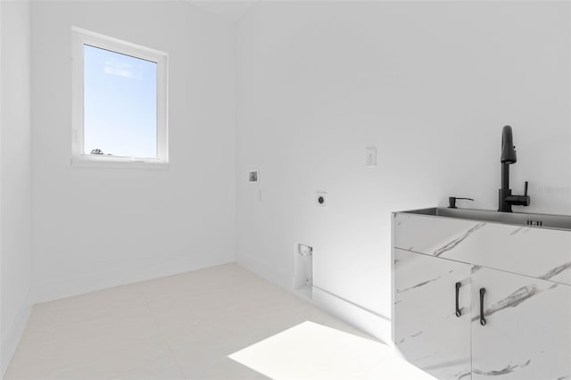 washroom with hookup for an electric dryer and sink