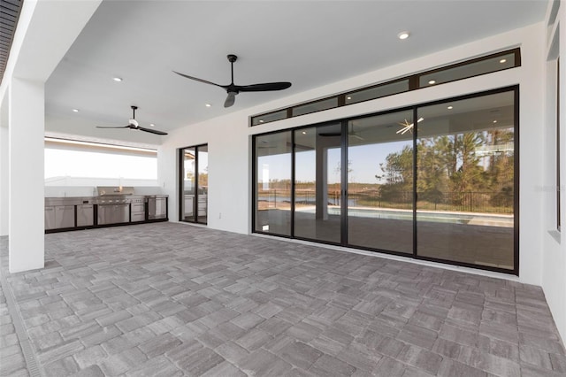 unfurnished living room featuring ceiling fan