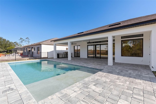 view of pool featuring a patio and ceiling fan