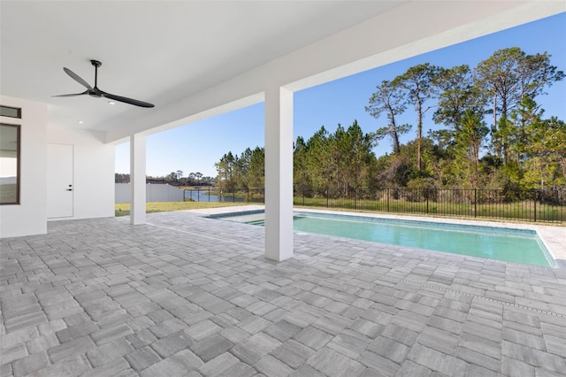 view of pool with a patio area and ceiling fan