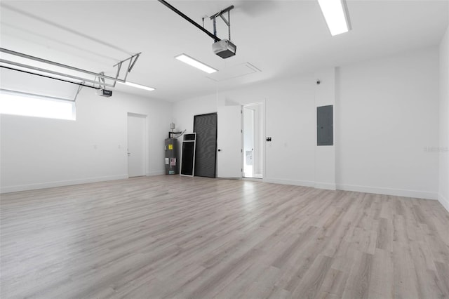 garage featuring a garage door opener, electric panel, and water heater