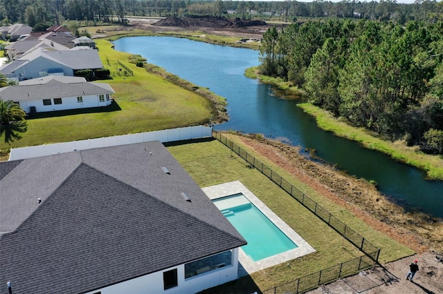 birds eye view of property with a water view