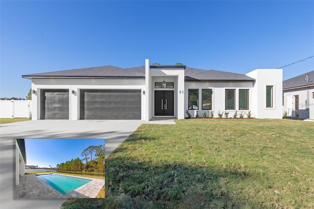 view of front facade featuring a garage and a front lawn