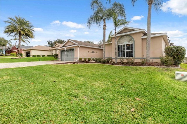 single story home featuring a garage and a front lawn