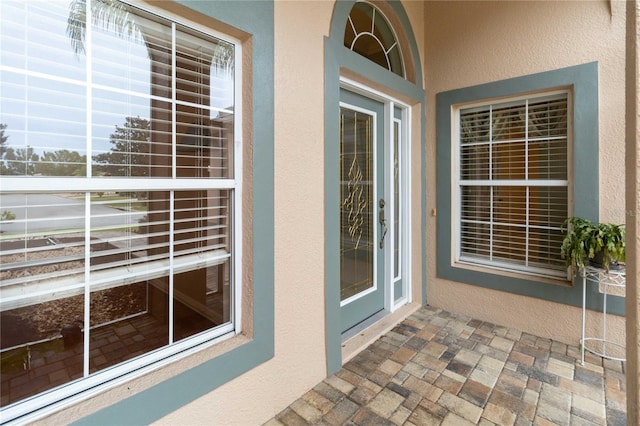 entrance to property with a balcony