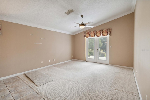 unfurnished room with a textured ceiling, lofted ceiling, french doors, ceiling fan, and crown molding