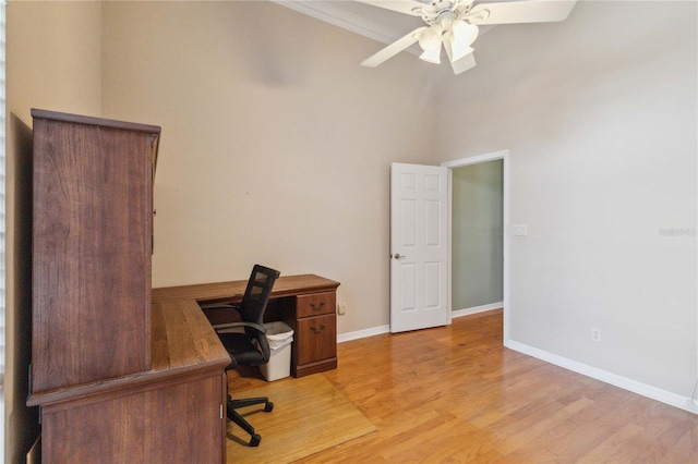 home office featuring light hardwood / wood-style floors and ceiling fan