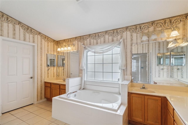 bathroom with tile patterned floors, vanity, and plus walk in shower