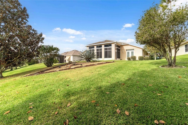 view of yard featuring a sunroom