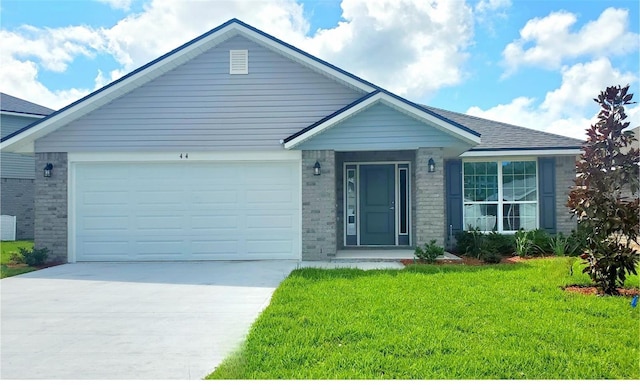 view of front of house featuring a front yard and a garage