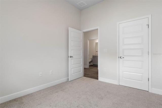 48 Bannbury Ln, Palm Coast, FL 32137 - unfurnished bedroom featuring carpet and baseboards