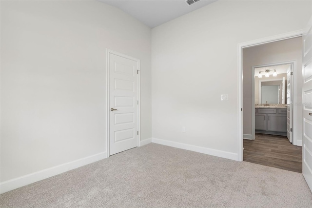 48 Bannbury Ln, Palm Coast, FL 32137 - empty room with carpet flooring, baseboards, and a sink