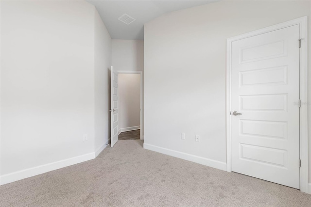 48 Bannbury Ln, Palm Coast, FL 32137 - unfurnished bedroom featuring carpet and baseboards