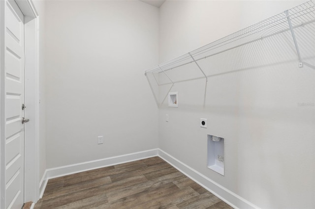 48 Bannbury Ln, Palm Coast, FL 32137 - laundry area with hookup for a washing machine, electric dryer hookup, dark wood-style floors, and baseboards