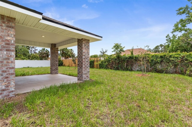 48 Bannbury Ln, Palm Coast, FL 32137 - view of yard featuring a patio area