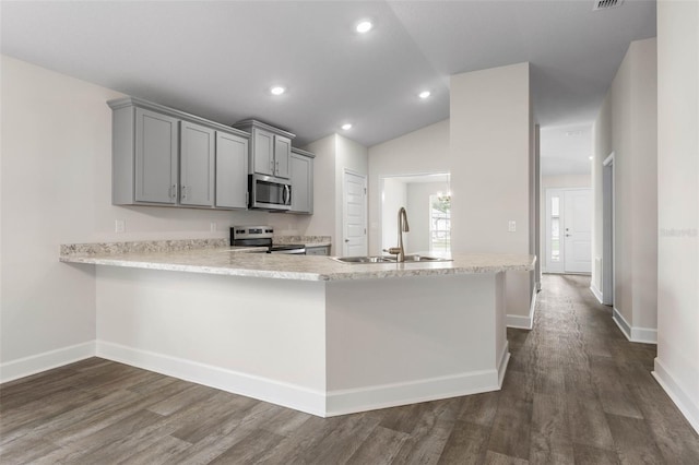 48 Bannbury Ln, Palm Coast, FL 32137 - kitchen with appliances with stainless steel finishes, a sink, gray cabinets, light countertops, and dark wood-type flooring